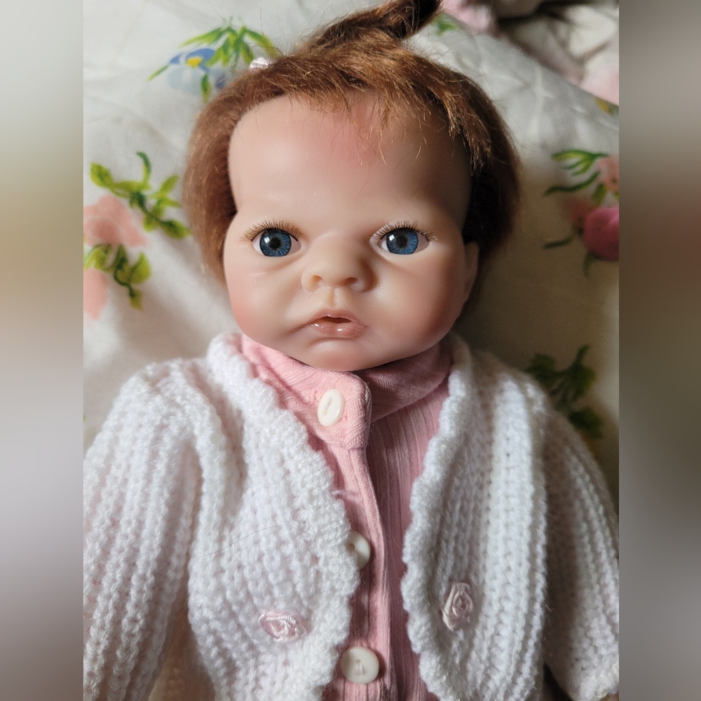 Lifelike Pink and White Baby Doll with Knitted Cardigan